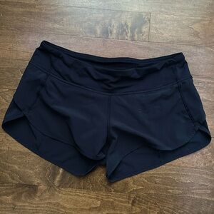 Size 6, 2.5 inch speed up lululemon shorts, blue hemming, navy blue.